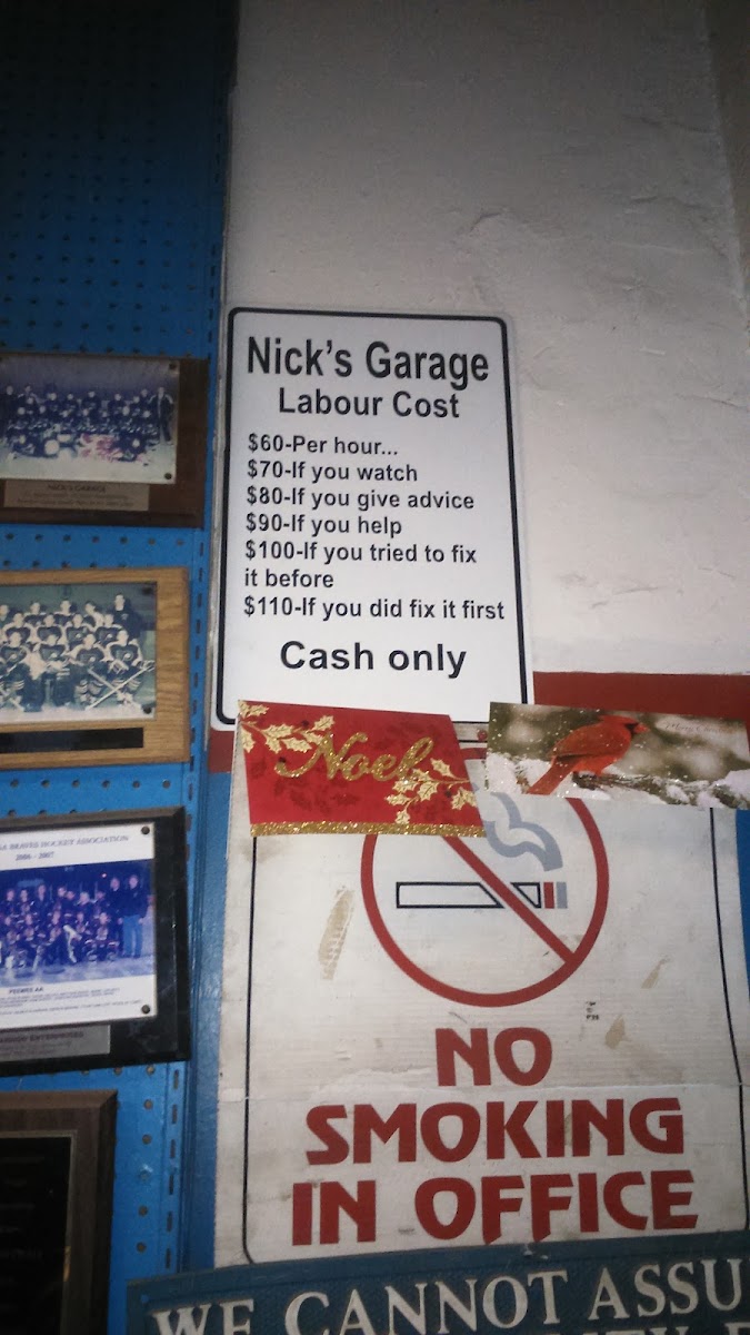 A car under service at Nick's Garage